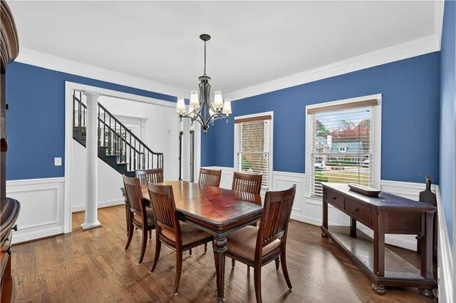 a view of a dining room with furniture window and wooden floor