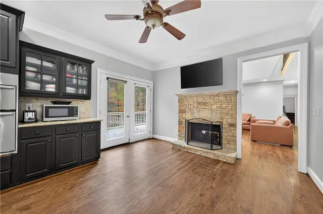 a living room with furniture fireplace and flat screen tv