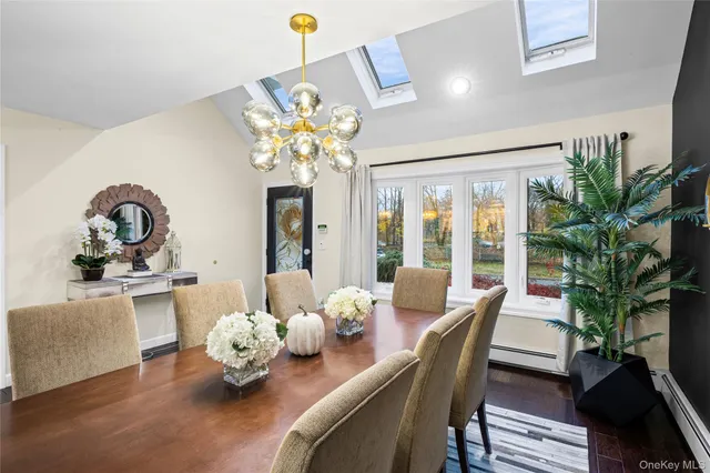 a dining room with furniture a livingroom and chandelier