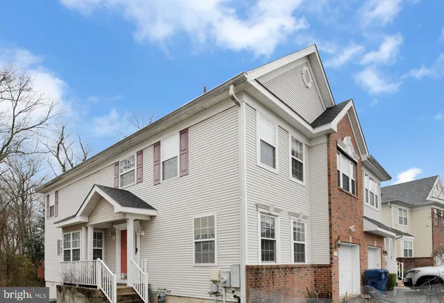 a view of a white building among the street