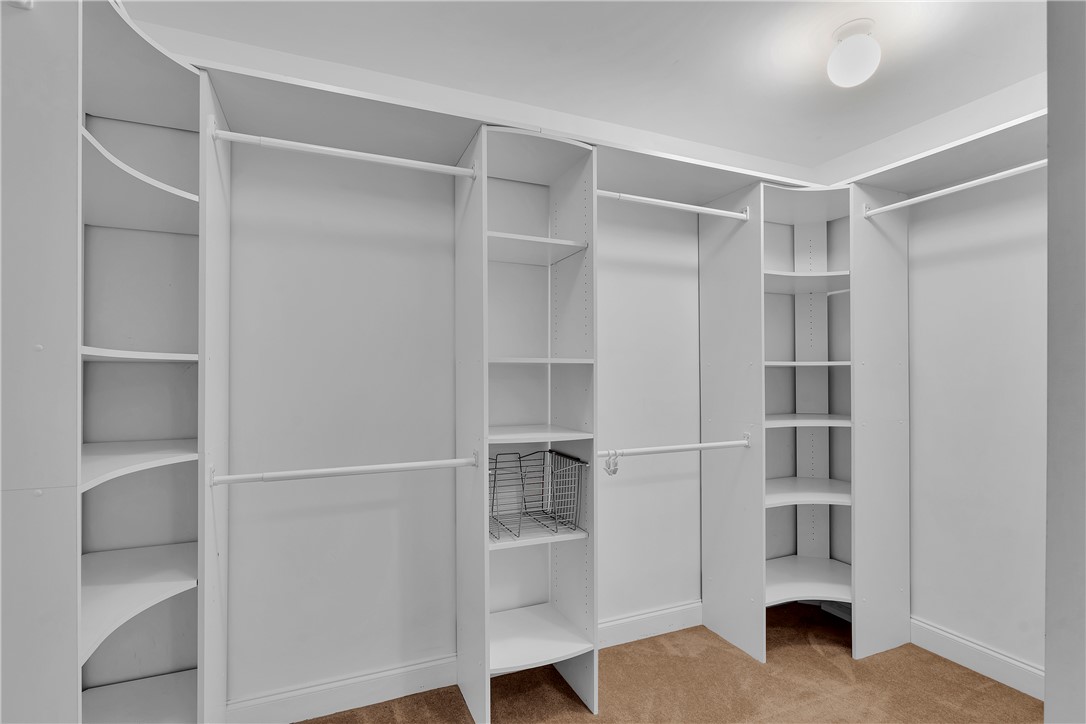 406 Hopewell Ridge Anderson, SC 29621 - Photo 24 of 46 This spacious walk-in closet features ample shelving and hanging space, providing exceptional organization.