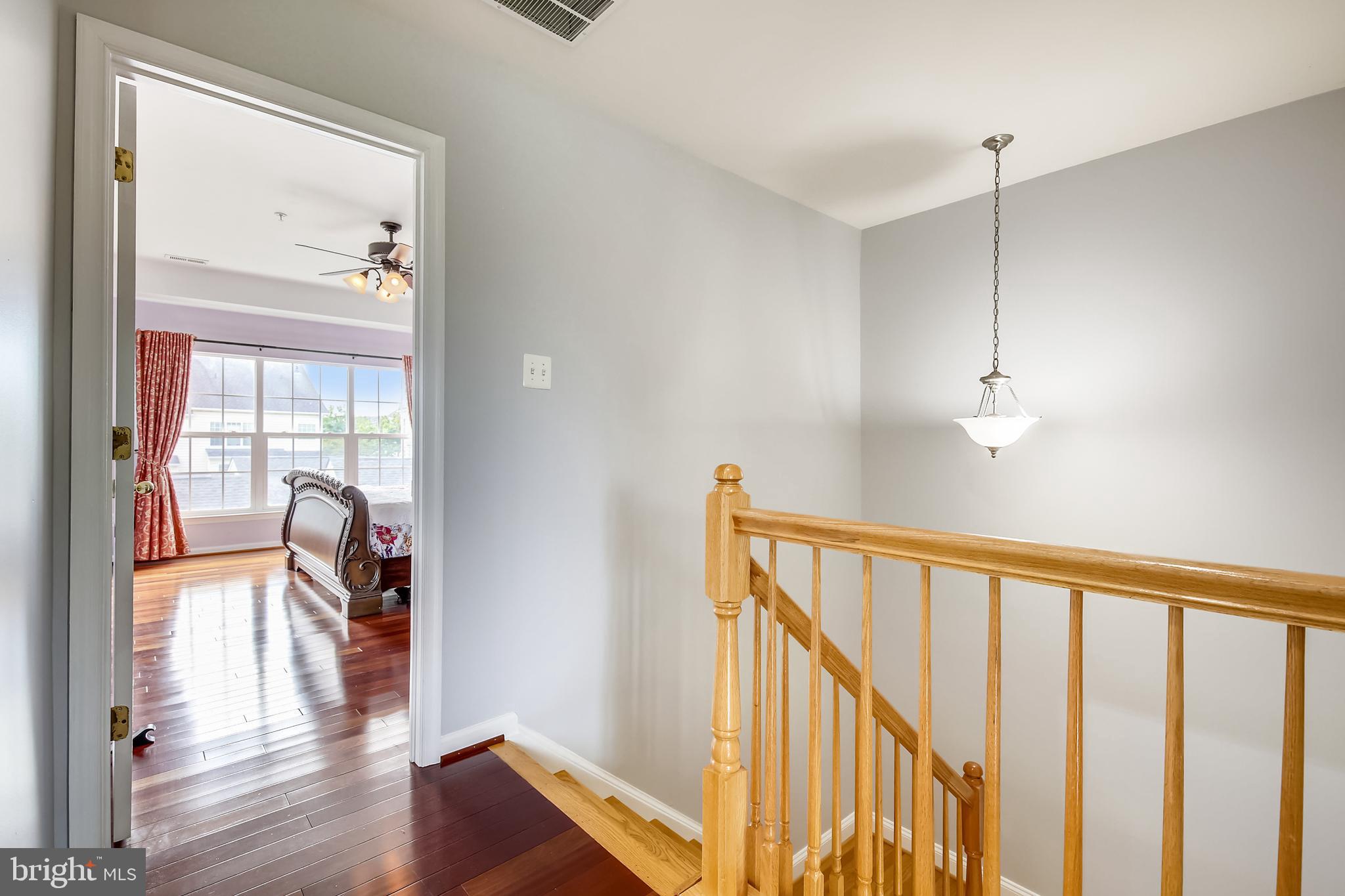 12224 Cypress Spring Road Clarksburg, MD 20871 - Photo 43 of 98 Freshly Painted Hallway w/Brazilian Cherry Floors