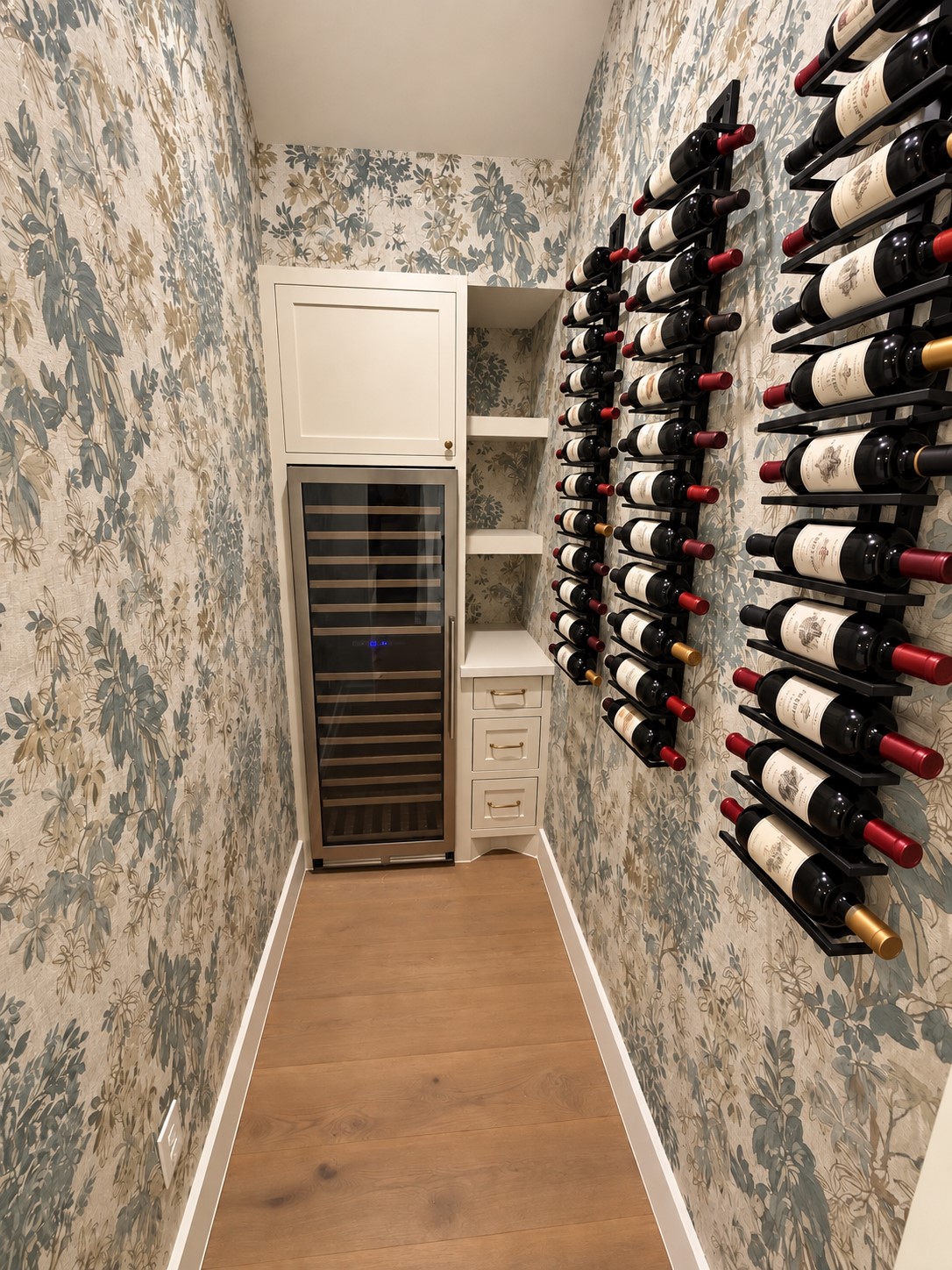 2325 Wroxton Road Houston, TX 77005 - Photo 9 of 34 Dedicated wine room with oversized wine fridge and custom built ins and wallpaper