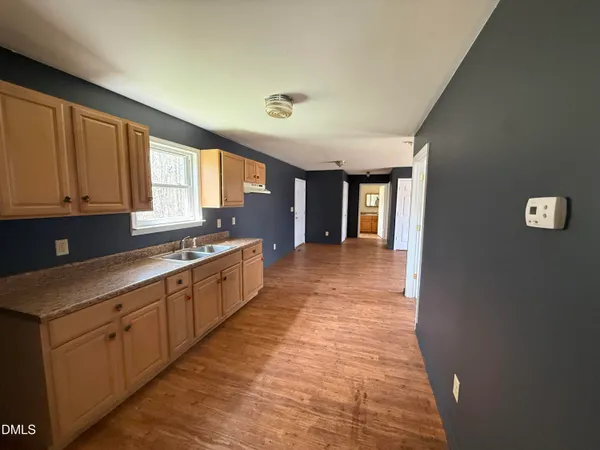 a large kitchen with cabinets
