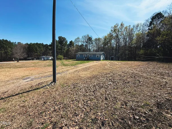 a backyard of a house with a yard