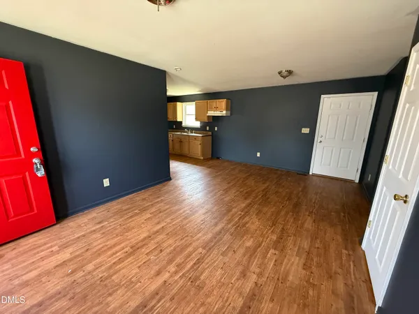 a view of a livingroom with wooden floor