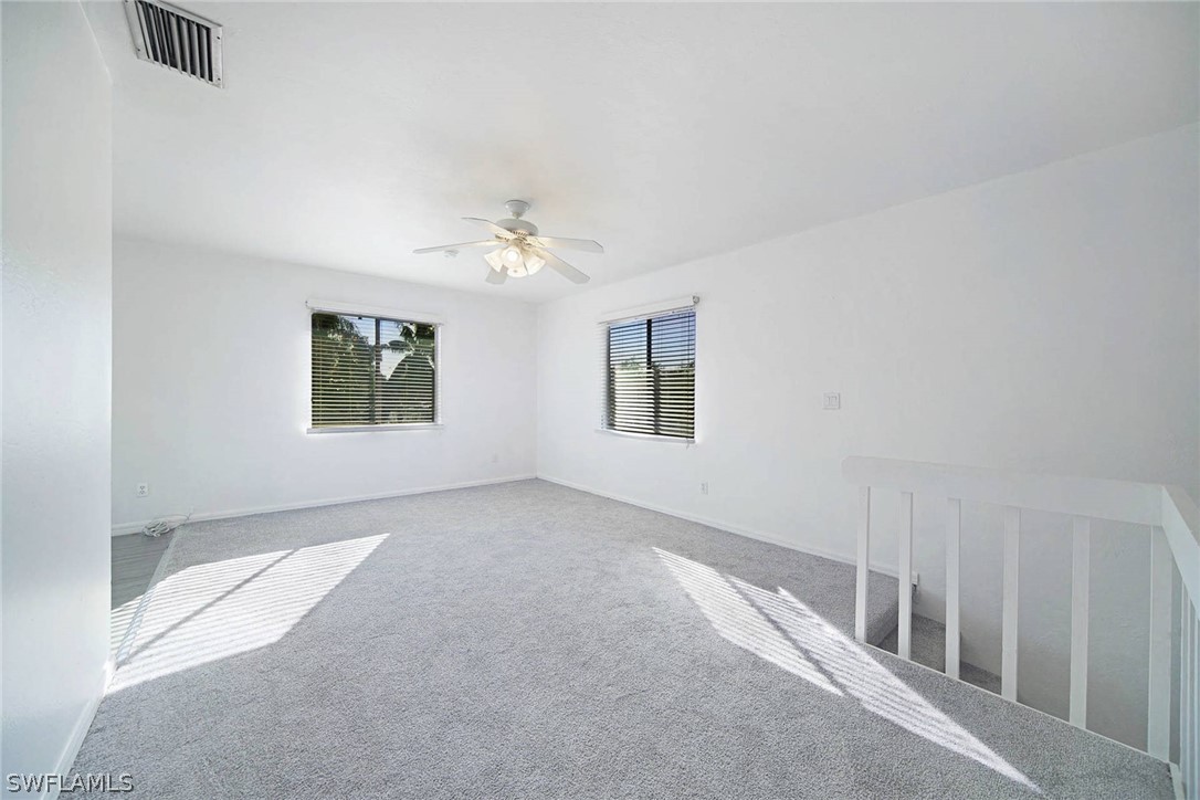 8397 Matanzas Road Fort Myers, FL 33967 - Photo 8 of 22 a view of an empty room with windows