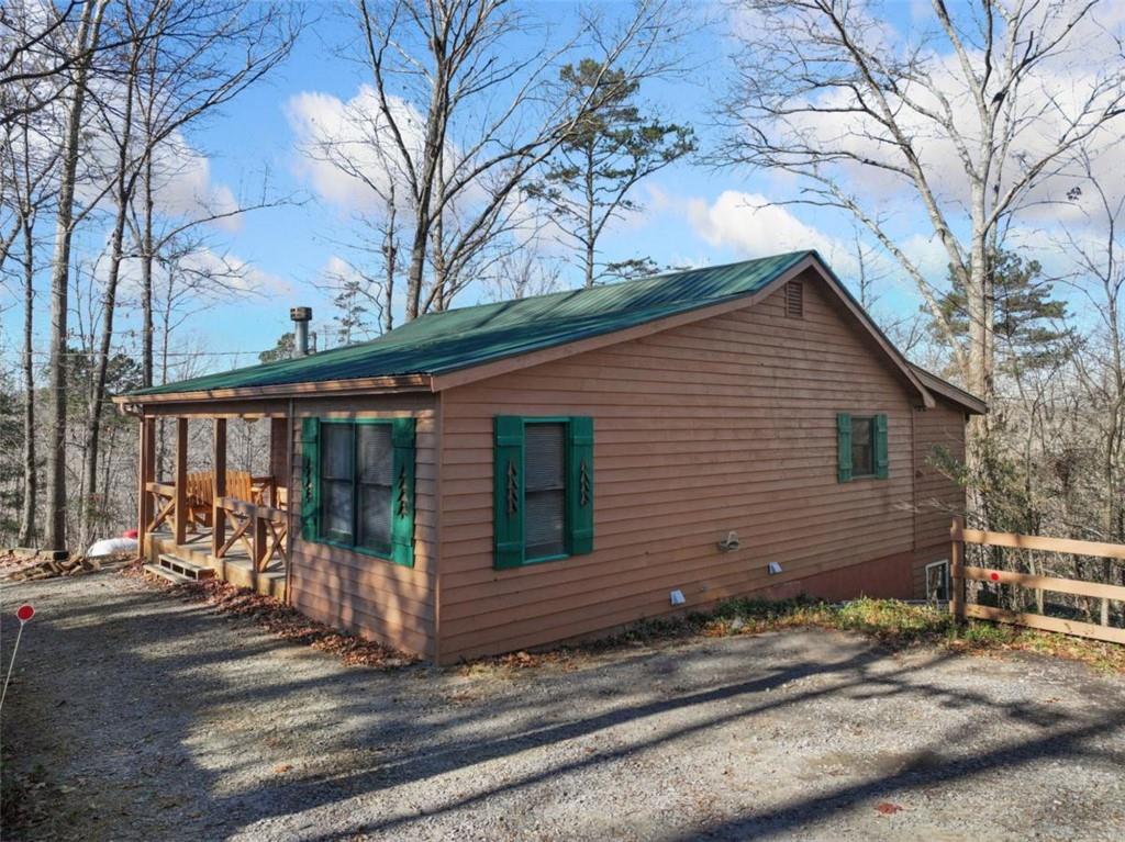 421 Cherokee Court Ellijay, GA 30540 - Photo 29 of 62 a view of a house with a small yard