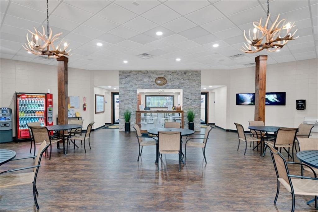 421 Cherokee Court Ellijay, GA 30540 - Photo 57 of 62 a view of a dining room with furniture window and wooden floor