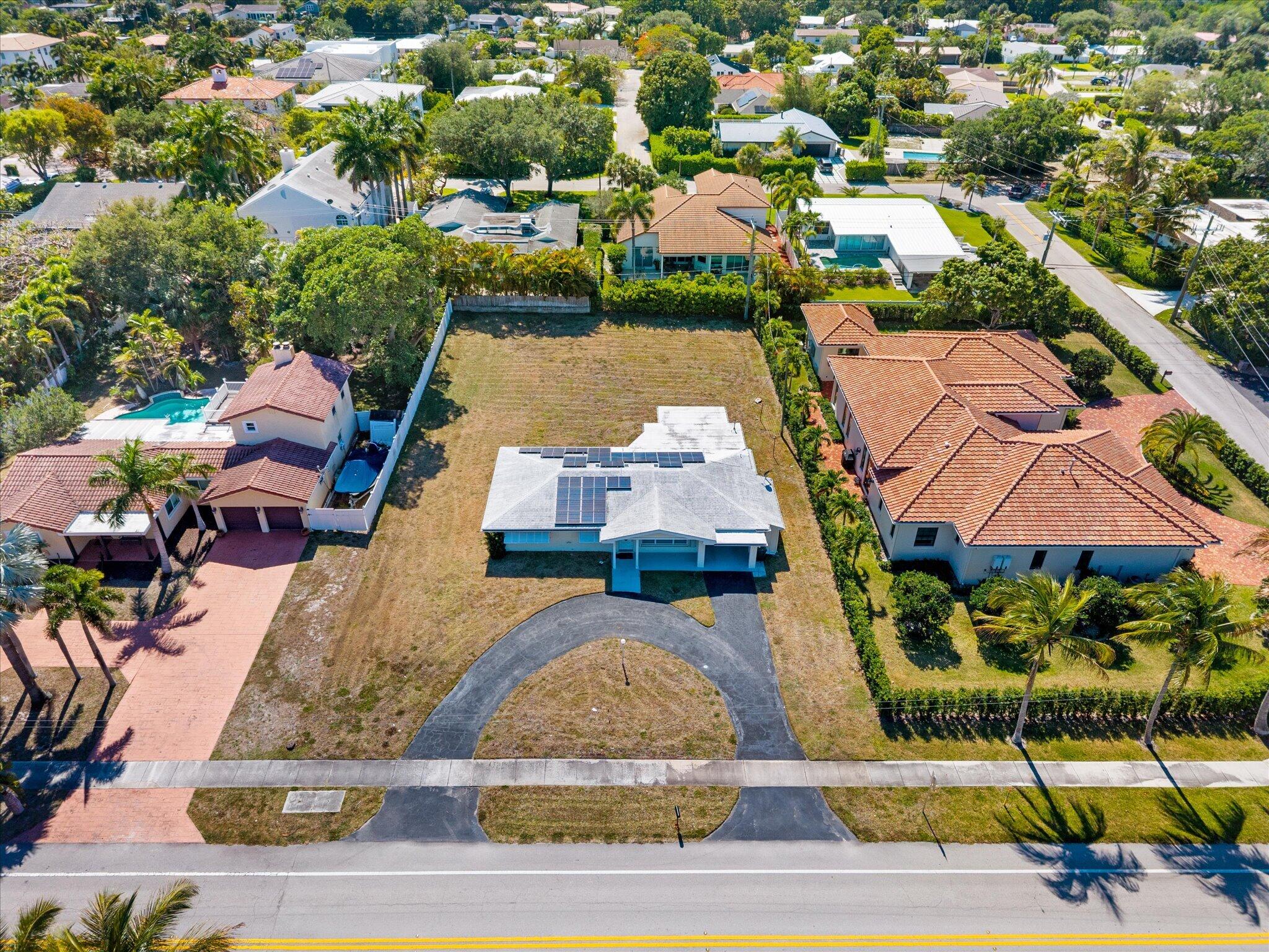 1035 Northwest 4th Avenue Boca Raton, FL 33432 - Photo 1 of 16 an aerial view of a house with yard swimming pool and outdoor seating