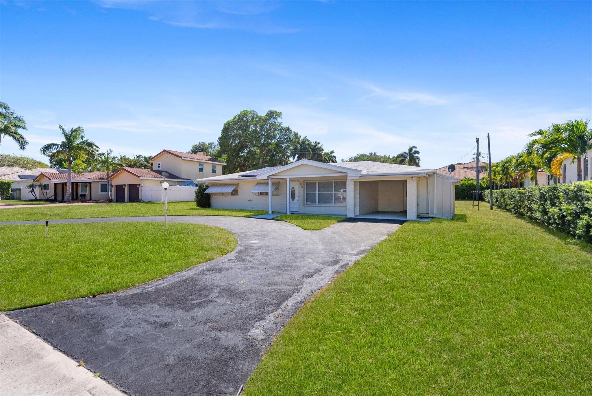 1035 Northwest 4th Avenue Boca Raton, FL 33432 - Photo 15 of 16 a view of an house with backyard space and sitting area