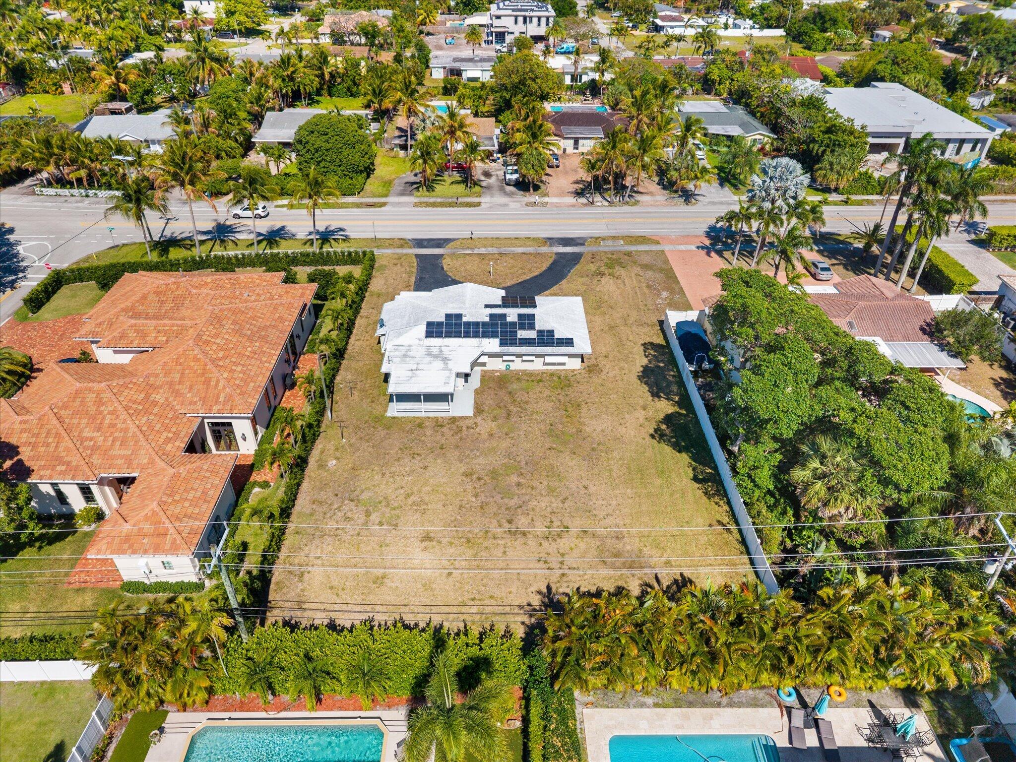 1035 Northwest 4th Avenue Boca Raton, FL 33432 - Photo 5 of 16 an aerial view of a house with a yard and lake view