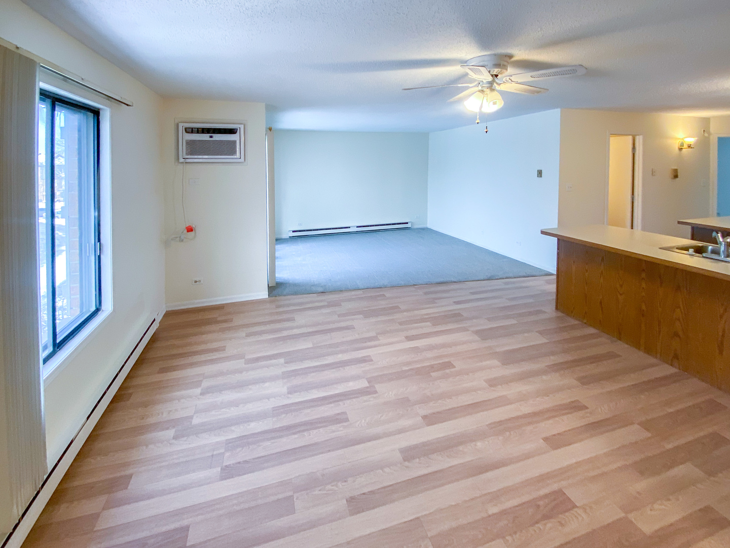 661 Briar Hill Lane, Unit 5 Addison, IL 60101 - Photo 2 of 15 wooden floor in an empty room with a window