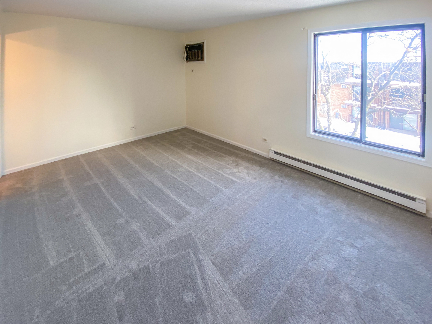 661 Briar Hill Lane, Unit 5 Addison, IL 60101 - Photo 8 of 15 an empty room with a window