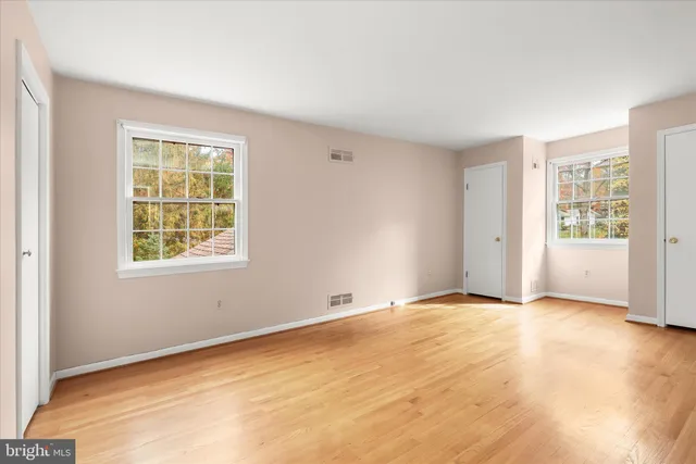 a bathroom with a sink vanity mirror and toilet
