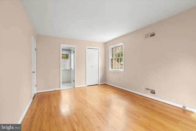 a bedroom with a bed and a cabinets