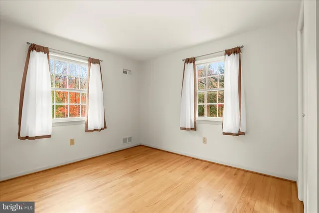 a view of a room with wooden walls
