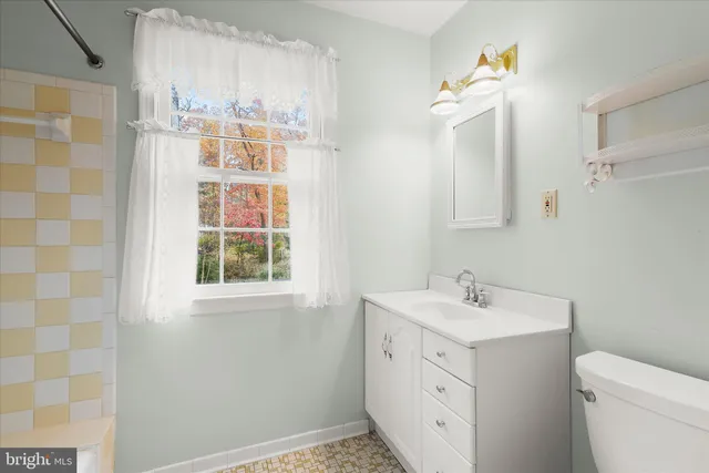 a front view of a house with garden and porch