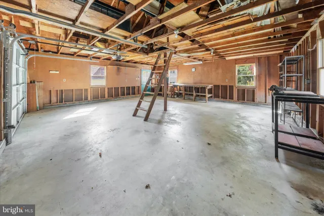 a view of a field with trees in the background