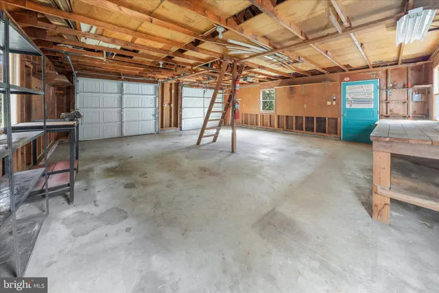 a front view of a house with a garden and yard