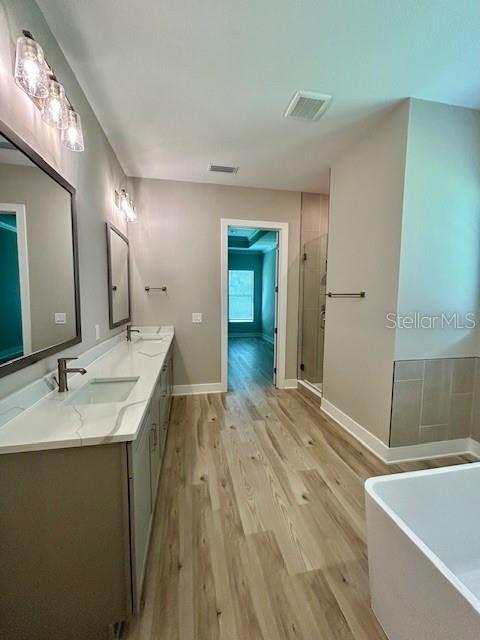 13530 Oldenburg Drive Hudson, FL 34667 - Photo 10 of 13 a bathroom with a sink and a mirror