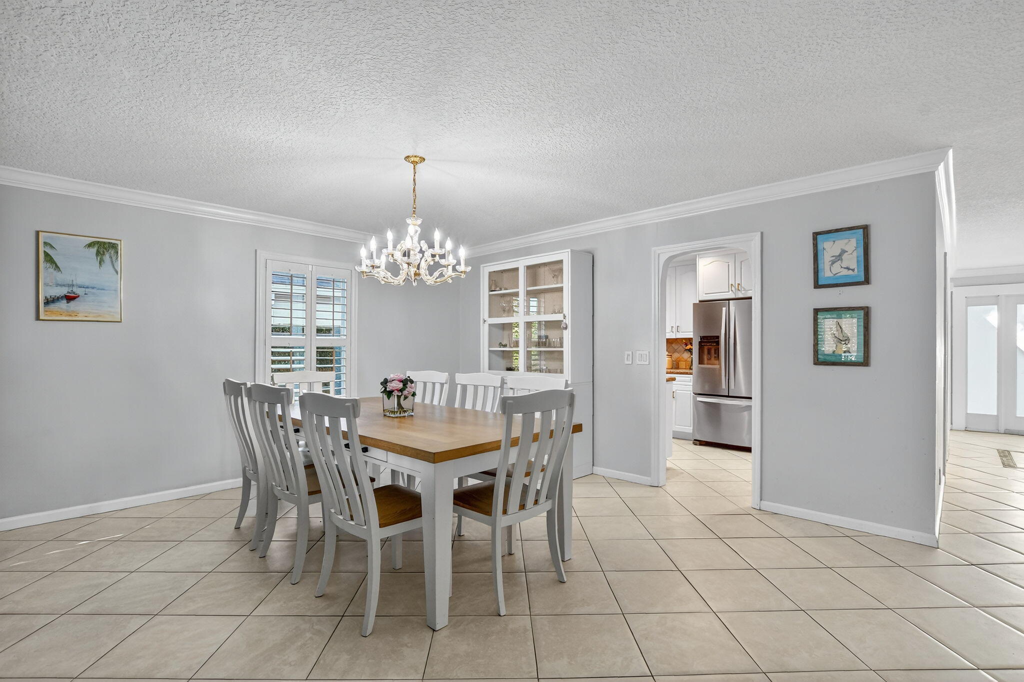 501 Southwest 1st Street Boca Raton, FL 33432 - Photo 13 of 69 a view of a dining room with furniture and chandelier