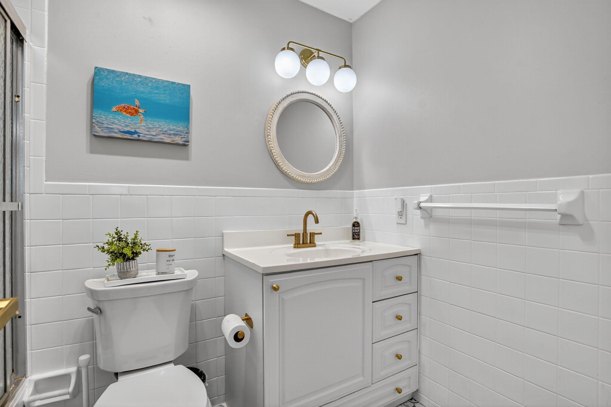 501 Southwest 1st Street Boca Raton, FL 33432 - Photo 27 of 69 a bathroom with a toilet a sink and mirror