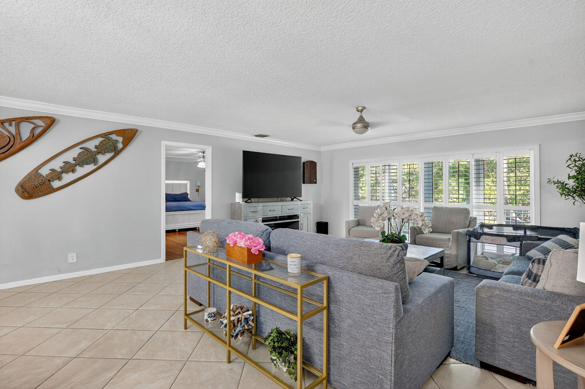 501 Southwest 1st Street Boca Raton, FL 33432 - Photo 9 of 69 a living room with furniture and a flat screen tv