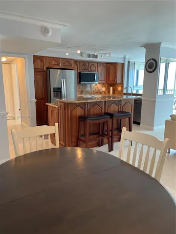 a view of kitchen with furniture and window