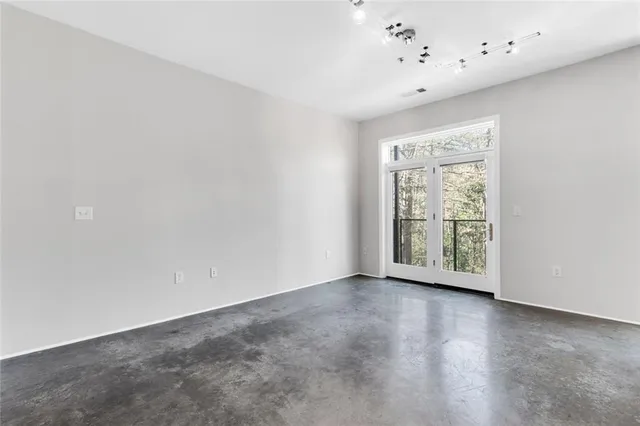 a view of an empty room with a window