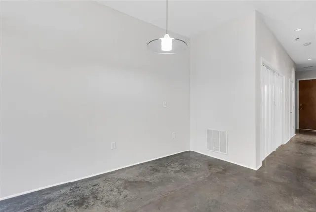 a view of a small space with wooden floor