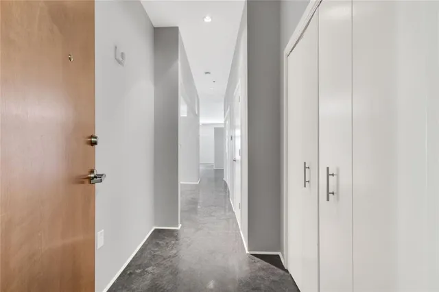 a view of a hallway with two rooms