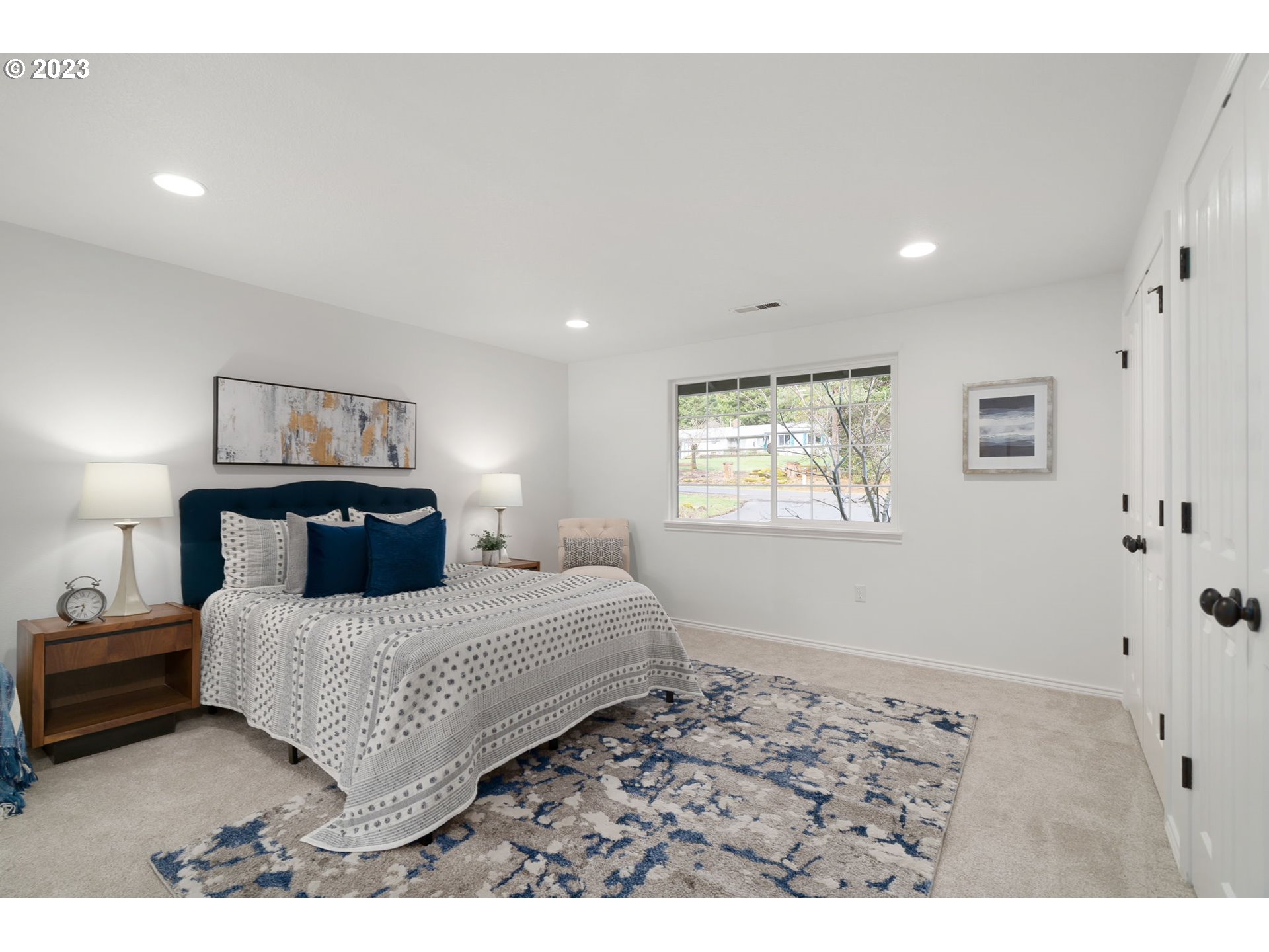 21055 South Ferguson Road Oregon City, OR 97045 - Photo 17 of 46 a bedroom with a bed and a painting on the wall