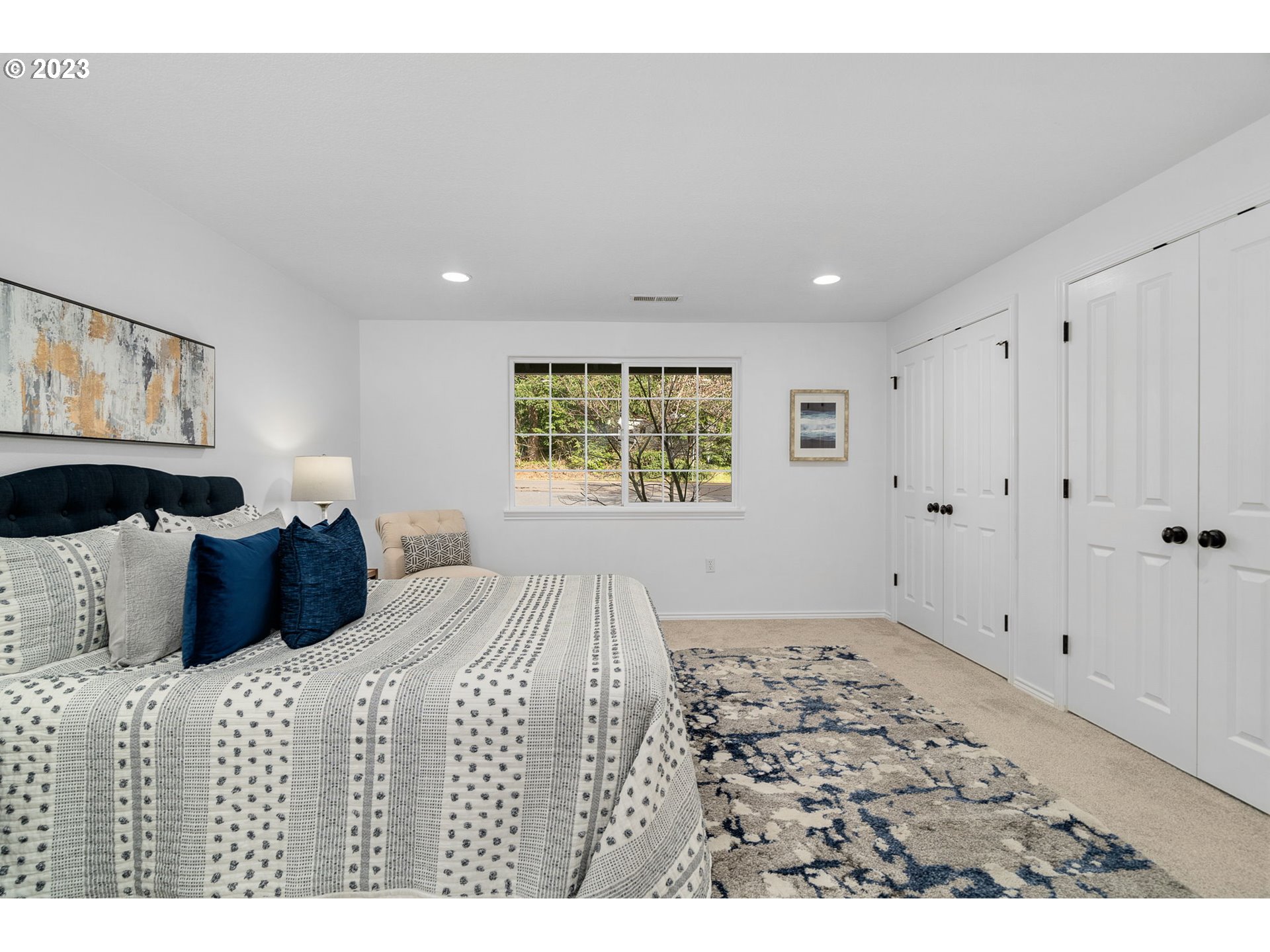 21055 South Ferguson Road Oregon City, OR 97045 - Photo 18 of 46 a bedroom with a large bed and a window