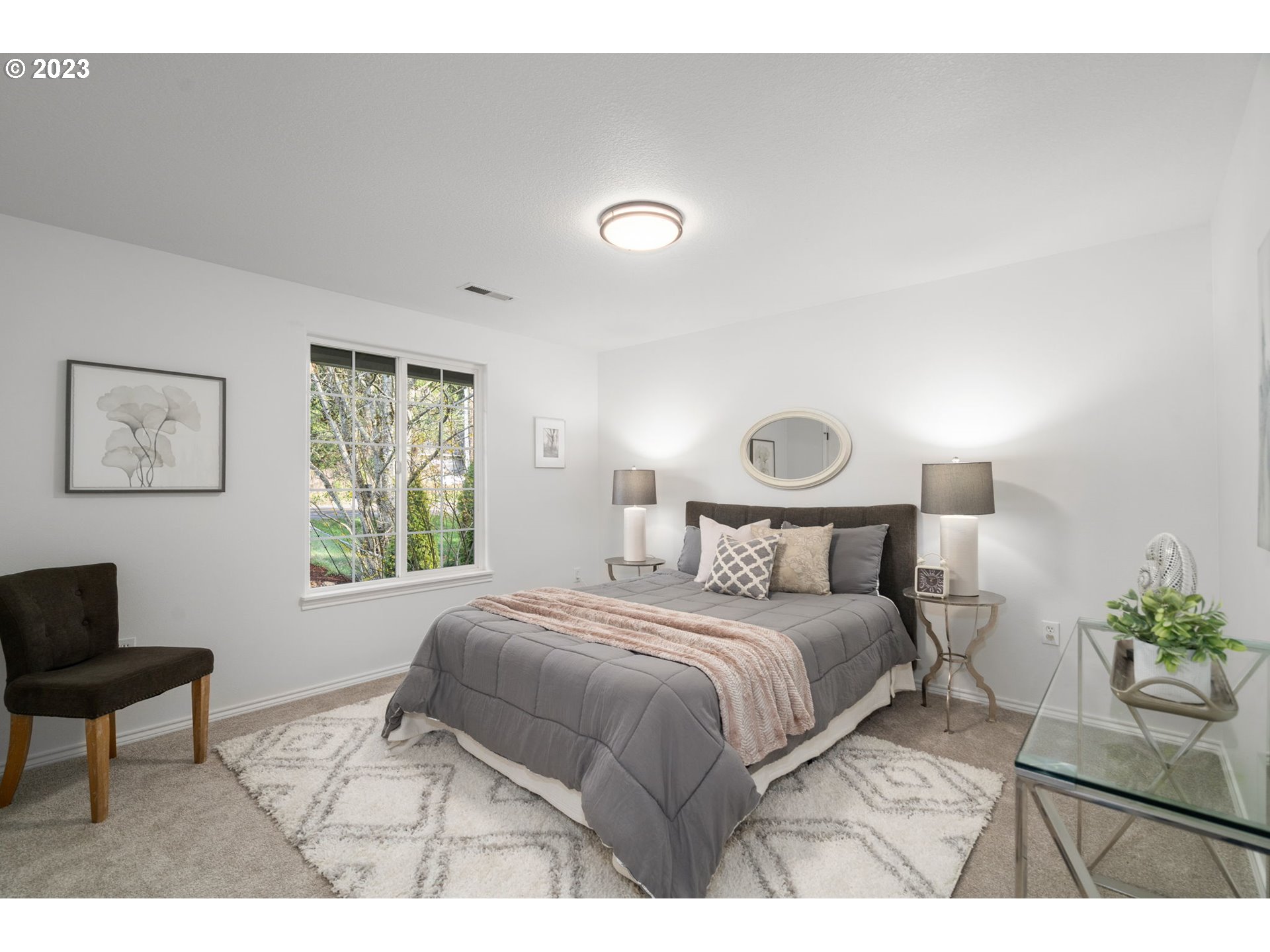 21055 South Ferguson Road Oregon City, OR 97045 - Photo 21 of 46 a bedroom with a bed and a chair
