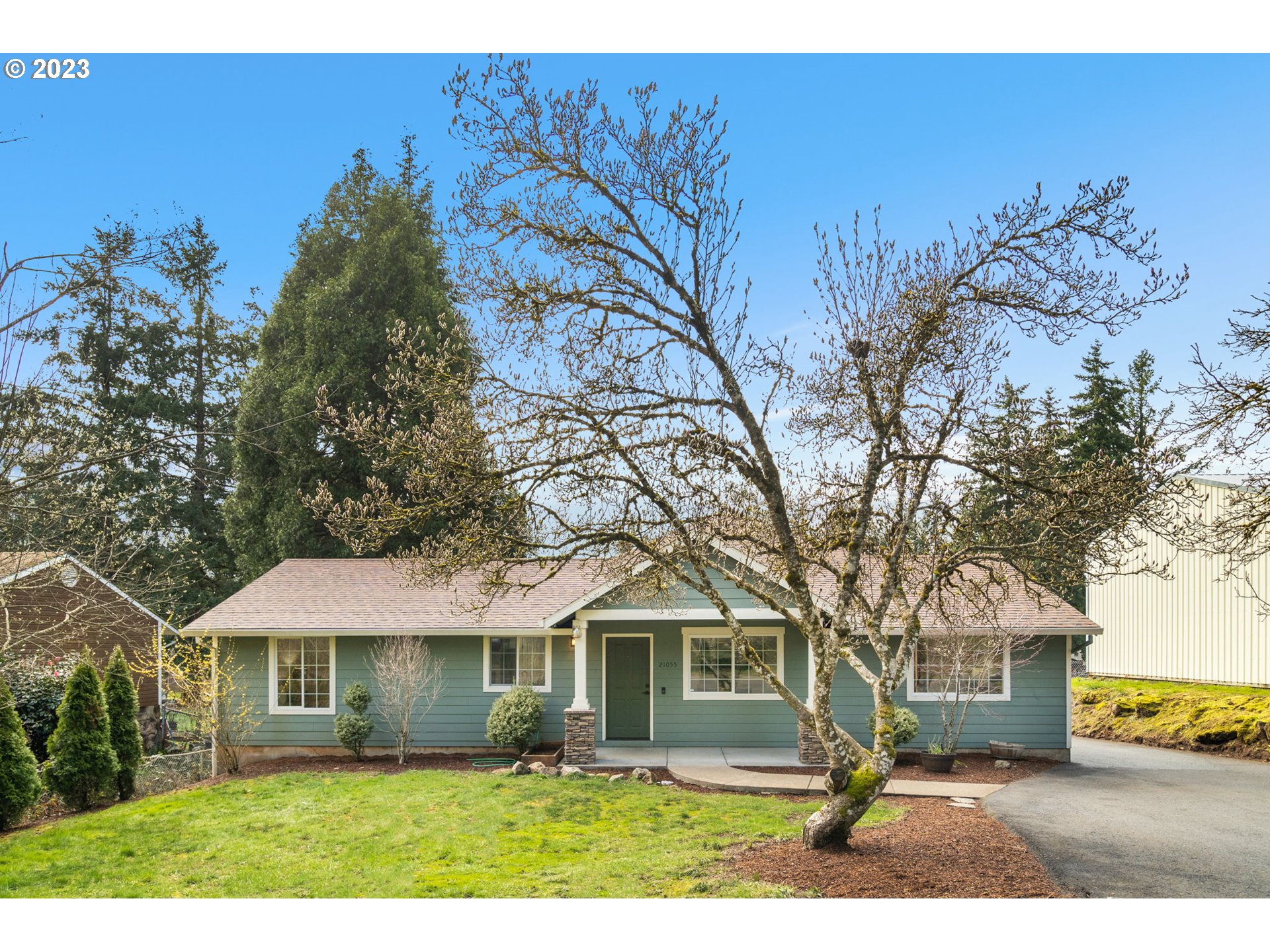 21055 South Ferguson Road Oregon City, OR 97045 - Photo 33 of 46 a front view of a house with a garden