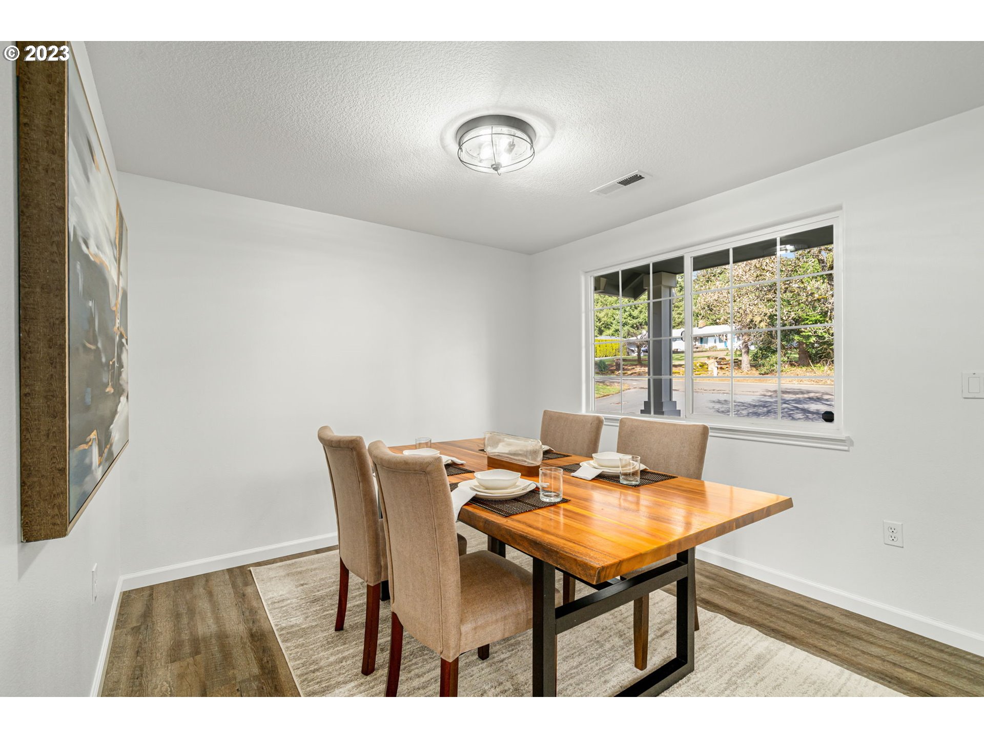21055 South Ferguson Road Oregon City, OR 97045 - Photo 5 of 46 a view of a dining room with furniture and a window