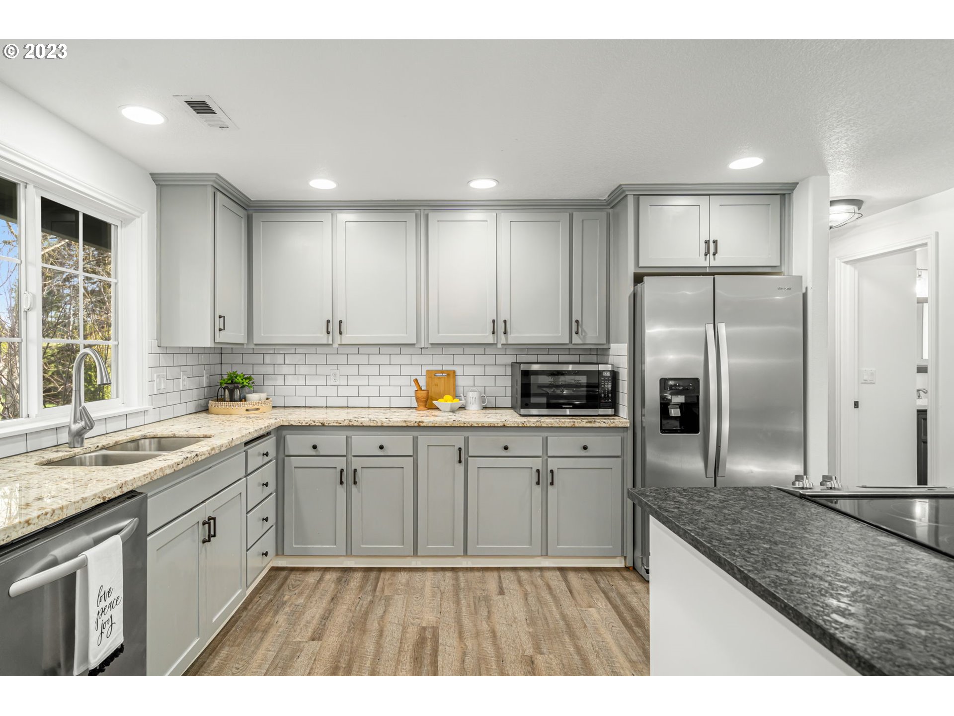 21055 South Ferguson Road Oregon City, OR 97045 - Photo 9 of 46 a kitchen with cabinets and stainless steel appliances