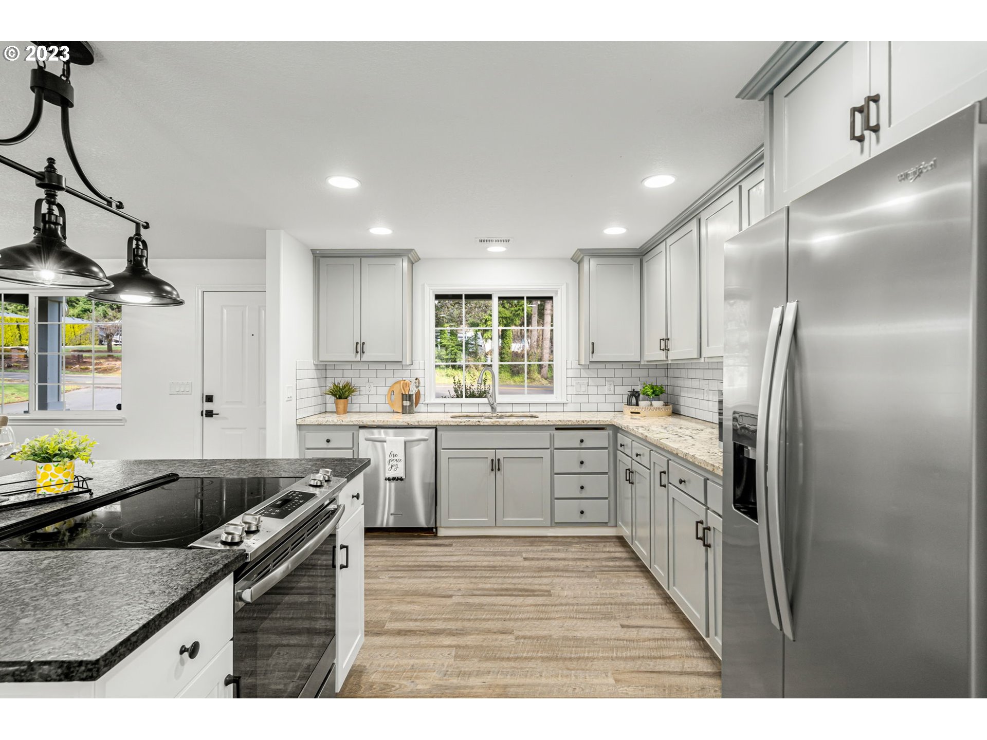 21055 South Ferguson Road Oregon City, OR 97045 - Photo 10 of 46 a kitchen with stainless steel appliances granite countertop a sink a stove and refrigerator