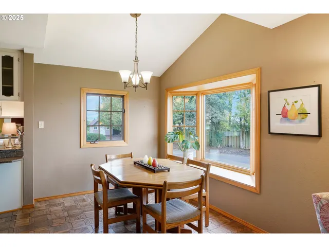 a view of a dining room with furniture window and outside view