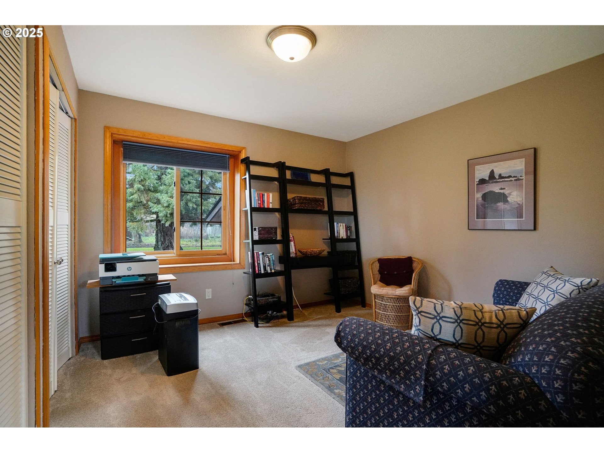 11515 Buena Vista Road Independence, OR 97351 - Photo 26 of 45 a living room with furniture a large window and bookshelf
