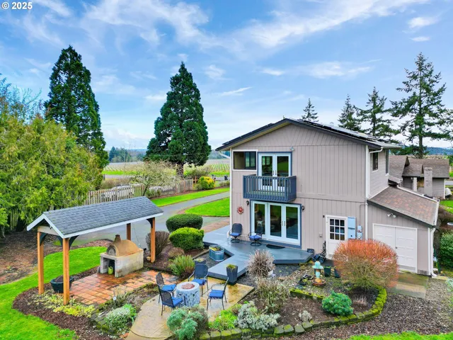 a view of an house with backyard space and garden