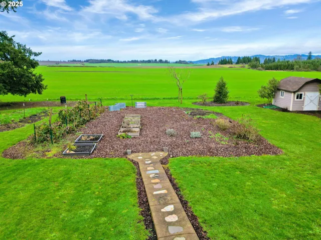 a view of a garden with a lake