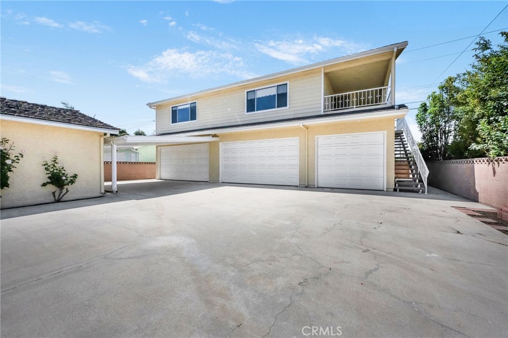 9470-9472 Foster Road Bellflower, CA 90706 - Photo 38 of 61 staircase entrance to rear unit located on second floor