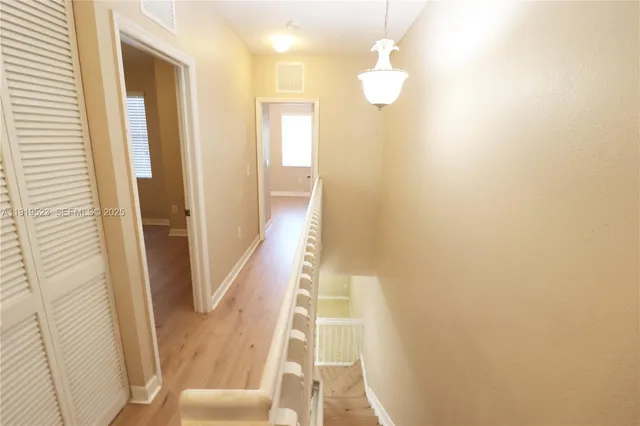 a view of a bathroom with sink and mirror