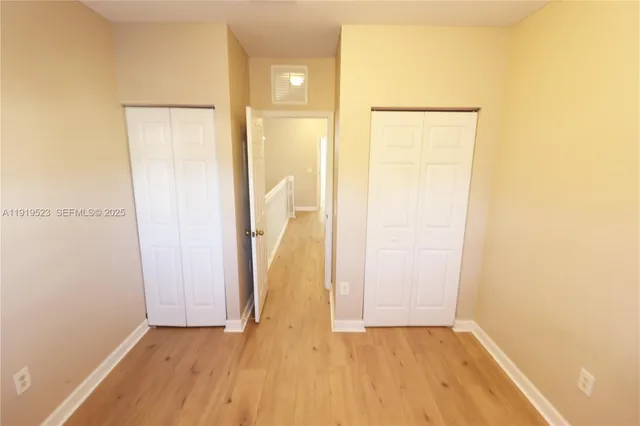 a view of a small space with wooden floor