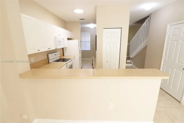 a view of a living room with a sink
