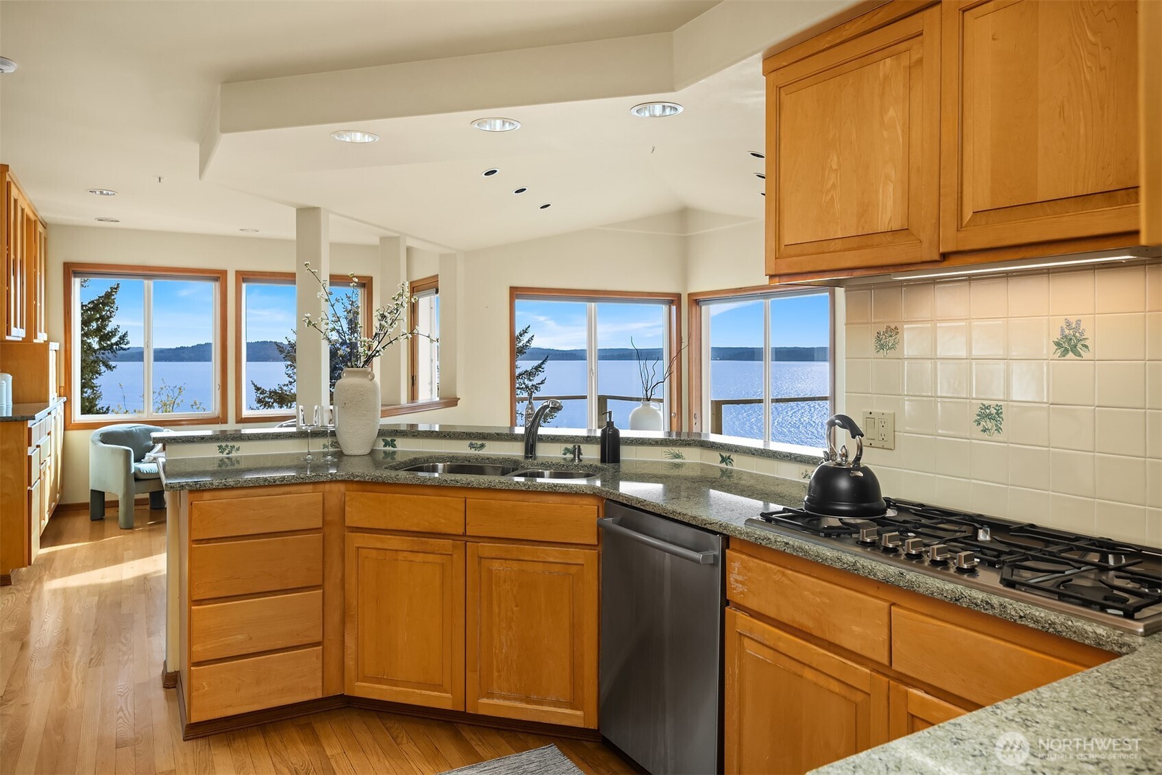2861 Southwest 171st Street Burien, WA 98166 - Photo 9 of 39 a kitchen with granite countertop a sink stove and cabinets