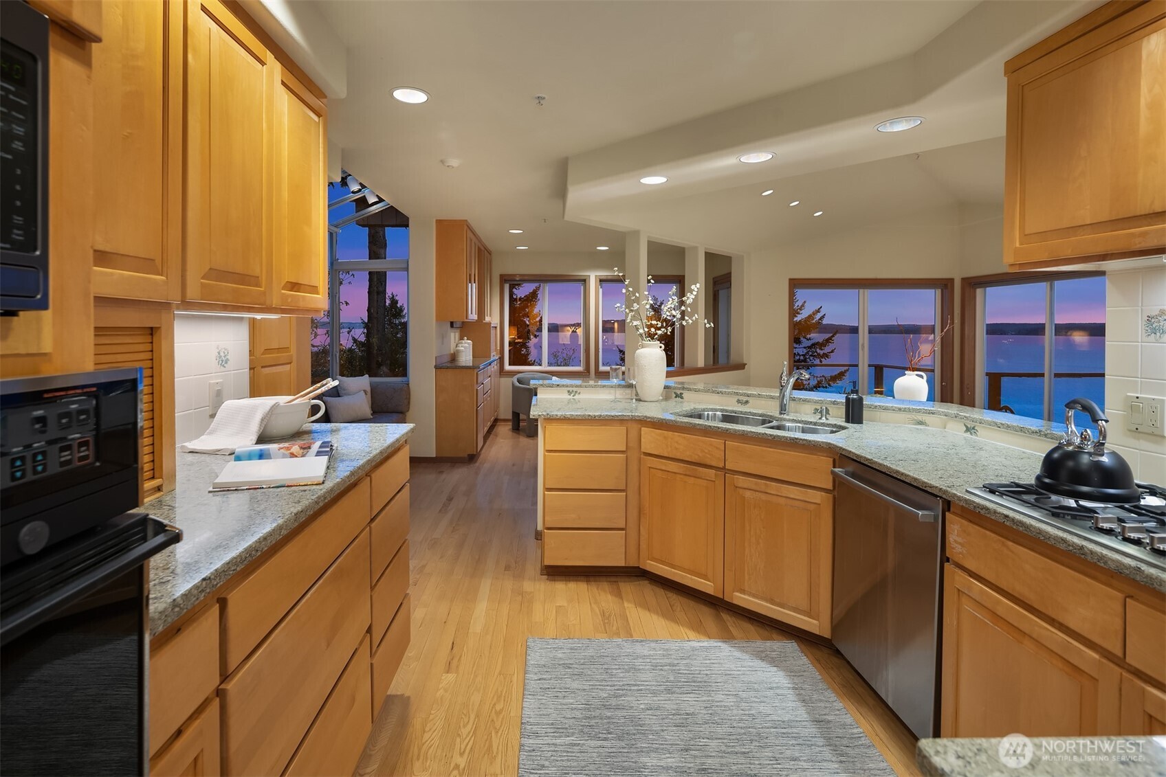 2861 Southwest 171st Street Burien, WA 98166 - Photo 10 of 39 a kitchen with stainless steel appliances granite countertop sink stove and cabinets