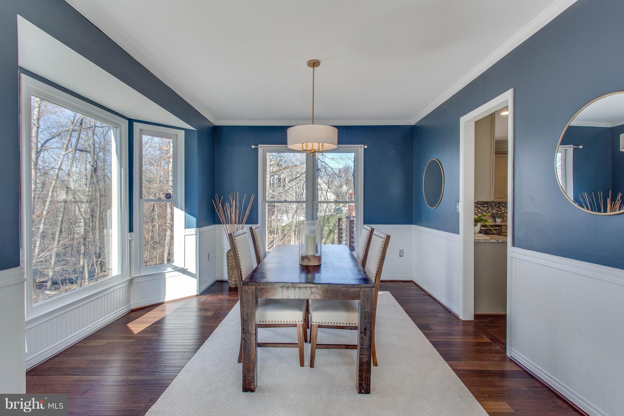 13230 Stable Brook Way Herndon, VA 20171 - Photo 6 of 47 The dining room feels dramatic and exciting.